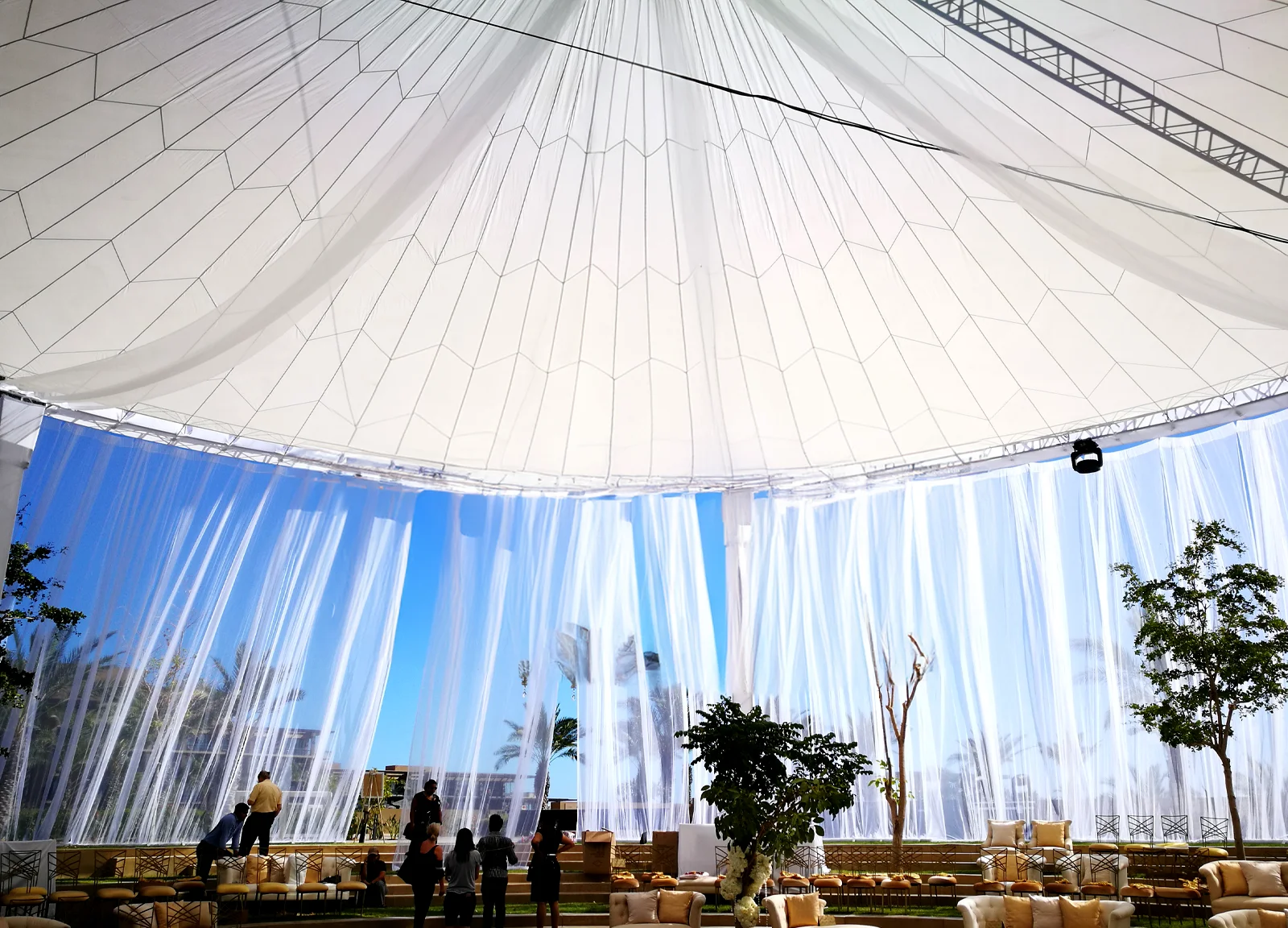Structure covered with transparent white curtains.